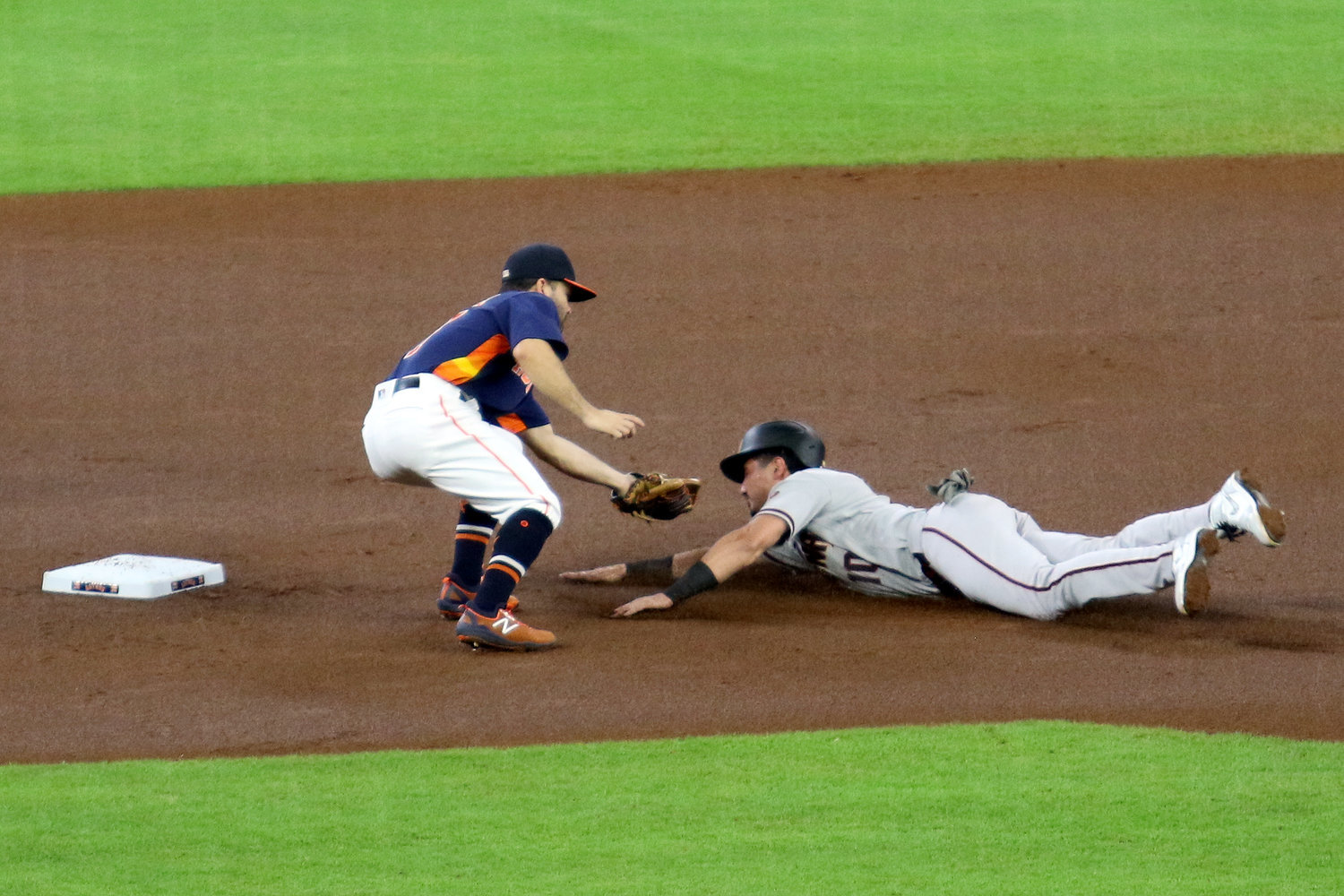 George Springer of the Houston Astros dives for home to score on an inside the park home run in the 6th inning of Sunday’s game against the Arizona Diamondbacks at Minute Maid Park. The Astros won 3-2.